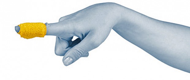 Adhesive Healing plaster on finger. Pain concept photo.